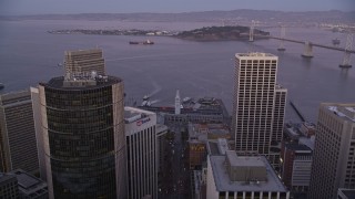 AXSF10_078 - 5K aerial stock footage follow Market Street to approach and tilt to Ferry Building, Downtown San Francisco, California, twilight