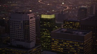 AXSF10_093 - 5K aerial stock footage fly over skyscrapers, reveal freeway and police station in South of Market, San Francisco, California, twilight