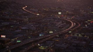 AXSF10_094 - 5K aerial stock footage heavy traffic on Interstate 80 by SFPD and County Jail, South of Market, San Francisco, California, twilight