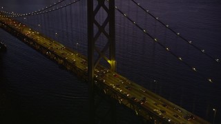 AXSF10_107 - 5K aerial stock footage tilt from Bay Bridge to reveal North Beach and Downtown San Francisco, California, twilight