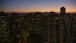 AXSF10_111 - 5K aerial stock footage pan from Ferry Building to reveal towering skyscrapers in Downtown San Francisco, California, twilight