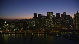 AXSF10_113 - 5K aerial stock footage flyby the skyline of Downtown San Francisco, reveal Ferry Building, California, twilight