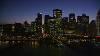 AXSF10_115 - 5K aerial stock footage passing by the Ferry Building and skyline of Downtown San Francisco, California, twilight