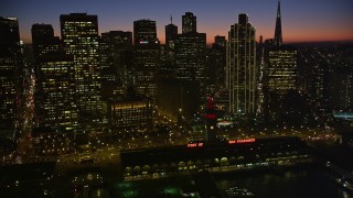 AXSF10_117 - 5K aerial stock footage fly by downtown skyline and reveal Ferry Building, Downtown San Francisco, California, twilight