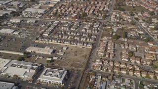 AXSF11_004 - 5K aerial stock footage reverse view of tract homes, reveal office buildings, Hayward, California