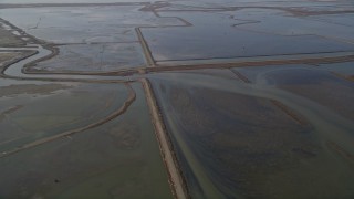AXSF11_005 - 5K aerial stock footage of flying by sloughs, Hayward, California