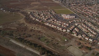 AXSF11_009 - 5K aerial stock footage of flying away from suburban tract homes, Union City, California