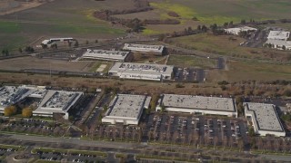 AXSF11_010 - 5K aerial stock footage reverse view of business park office buildings in Newark, California