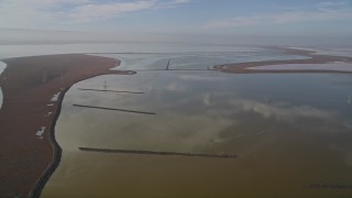 AXSF11_016 - 5K aerial stock footage of flying over wetlands in Newark, California