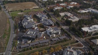 AXSF11_047 - 5K aerial stock footage of tilting to reveal office complexes, tilt to bird's eye of Googleplex buildings, Mountain View, California