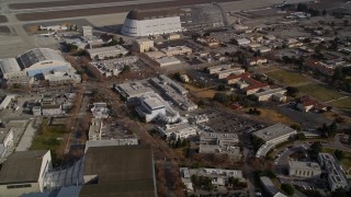 AXSF11_051 - 5K aerial stock footage tilt from NASA Ames Research Center, reveal Hangar One at Moffett Field, Mountain View, California