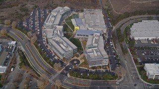 AXSF11_062 - 5K aerial stock footage tilt from parking lots, revealing Yahoo! Campus office buildings, Sunnyvale, California