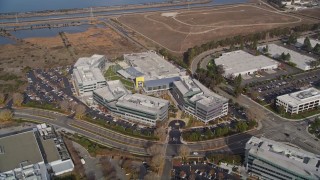 AXSF11_063 - 5K aerial stock footage tilt from marshlands to reveal and flyby Yahoo! Campus and office buildings, Sunnyvale, California