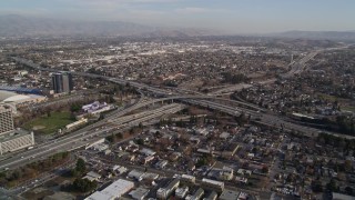 AXSF12_009 - 5K aerial stock footage flying by freeway interchange by Downtown San Jose, California