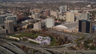 AXSF12_012 - 5K aerial stock footage flying over freeway interchange, tilt to reveal Downtown San Jose, California