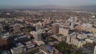 AXSF12_013 - 5K aerial stock footage tilt from museum, convention center for wider view of Downtown San Jose, and urban neighborhoods, California