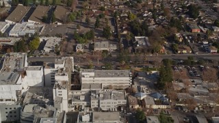 AXSF12_018 - 5K aerial stock footage reverse view of suburban neighborhoods, reveal Santa Clara Valley Medical Center, San Jose, California