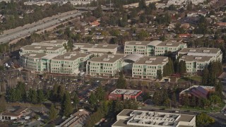 AXSF12_031 - 5K aerial stock footage of flying by Apple Headquarters office buildings, Cupertino, California