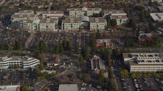 AXSF12_032 - 5K aerial stock footage tilt from Valley Green Drive revealing Apple Headquarters office buildings, Cupertino, California