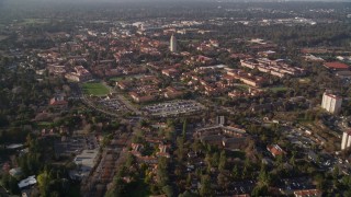 AXSF12_039 - 5K aerial stock footage tilt from apartment buildings to reveal and approach Hoover Tower and Stanford University, Stanford, California