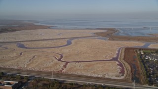AXSF12_060 - 5K aerial stock footage of flying by marshlands, Menlo Park, California