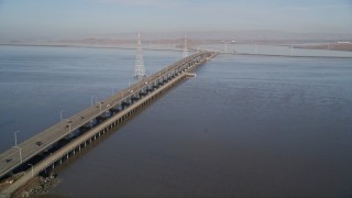 AXSF12_063 - 5K aerial stock footage tilt from wetlands to reveal San Francisco Bay and Dumbarton Bridge, California