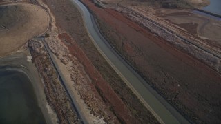 AXSF12_073 - 5K aerial stock footage of flying away from hills, marshland, Union City, California
