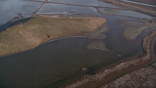 AXSF12_074 - 5K aerial stock footage of a reverse view of marshland in Union City, California