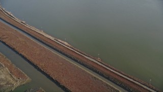 AXSF12_076 - 5K aerial stock footage of a reverse view of marshlands and canals, Union City, California