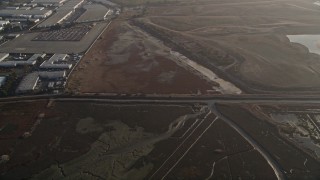 AXSF12_082 - 5K aerial stock footage of a reverse view of marshland, Hayward, California
