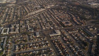 AXSF12_085 - 5K aerial stock footage reverse view of residential neighborhoods and shopping center by I-880, San Leandro, California