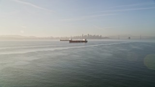 AXSF13_001 - 5K aerial stock footage of approaching oil tankers in San Francisco Bay, San Francisco, California
