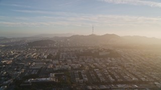 AXSF13_029 - 5K aerial stock footage of approaching Sutro Tower, shrouded in haze in San Francisco, California