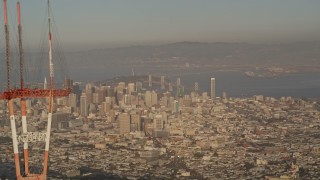 AXSF13_034 - 5K aerial stock footage of orbiting top of Sutro Tower, revealing Downtown San Francisco, California