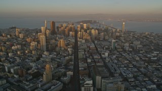 AXSF14_004 - 5K aerial stock footage of flying by Market Street and skyscrapers in Downtown San Francisco, California, sunset