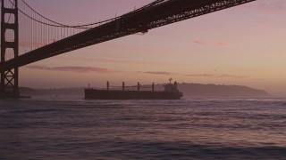 AXSF14_071 - 5K aerial stock footage track oil Tanker approaching Golden Gate Bridge, San Francisco, California, twilight