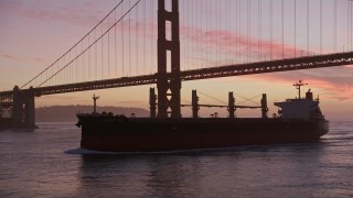 AXSF14_073 - 5K aerial stock footage flyby an oil tanker, reveal Golden Gate Bridge, San Francisco, California, twilight