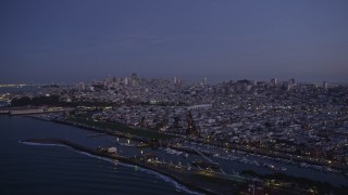 AXSF14_085 - 5K aerial stock footage of panning from Marina District to Downtown San Francisco skyline, California, twilight