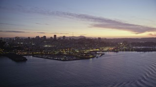 AXSF14_089 - 5K aerial stock footage of flying by Fisherman's Wharf in San Francisco, California, twilight