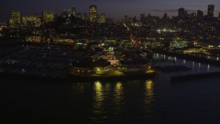 AXSF14_095 - 5K aerial stock footage approach and fly over Pier 39 in San Francisco, California, night