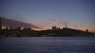 AXSF14_102 - 5K aerial stock footage of a view of Coit Tower and reveal Transamerica Pyramid, San Francisco, California, twilight