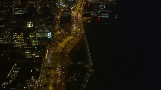 AXSF14_121 - 5K aerial stock footage fly by The Embarcadero and tilt up, Downtown San Francisco, California, night