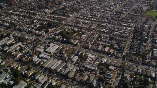 AXSF15_001 - 5K aerial stock footage of a reverse view of suburban neighborhoods, Alameda, California