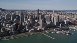 AXSF15_006 - 5K aerial stock footage of approaching waterfront skyscrapers and the Ferry Building in Downtown San Francisco, California