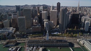 AXSF15_009 - 5K aerial stock footage of tilting from skyscrapers to the Ferry Building in Downtown San Francisco, California