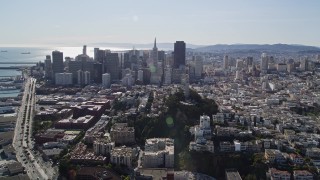 AXSF15_012 - 5K aerial stock footage of the Transamerica Pyramid, skyscrapers and Coit Tower, Downtown San Francisco, California