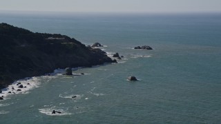 AXSF15_027 - 5K aerial stock footage of flying by coastal cliffs while approaching Seal Rocks, San Francisco, California