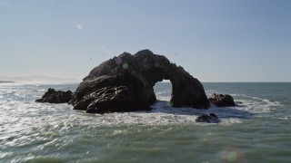 AXSF15_030 - 5K aerial stock footage fly low over ocean and tilt to reveal Seal Rocks rock formations, San Francisco, California