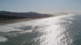 AXSF15_031 - 5K aerial stock footage of flying by Ocean Beach in Outer Richmond District, San Francisco, California