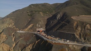 AXSF15_044 - 5K aerial stock footage of flying by Highway 1 along coast and a tunnel under construction, Pacifica, California